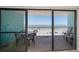 Balcony with outdoor seating offering views of the beach at 19440 Gulf Blvd # 306, Indian Shores, FL 33785