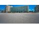 Exterior shot of condo building with beach access at 19440 Gulf Blvd # 306, Indian Shores, FL 33785
