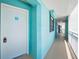 Hallway with unit door at 19440 Gulf Blvd # 306, Indian Shores, FL 33785