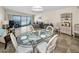 Open-concept living and dining area with a stunning ocean view and tile flooring at 19440 Gulf Blvd # 306, Indian Shores, FL 33785