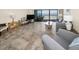Cozy living room with tile flooring, comfortable furniture, and a scenic ocean view at 19440 Gulf Blvd # 306, Indian Shores, FL 33785