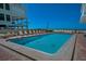 Refreshing pool with lounge chairs and ocean views, perfect for leisurely afternoons at 19440 Gulf Blvd # 306, Indian Shores, FL 33785