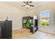 bedroom with a bunk bed, desk, and a bright green chair at 2250 Mountain Ash Way, New Port Richey, FL 34655