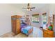 bedroom featuring a wooden bunk bed, desk, and two windows at 2250 Mountain Ash Way, New Port Richey, FL 34655