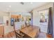 Bright dining area adjoining the kitchen, with views of the outdoor space at 2250 Mountain Ash Way, New Port Richey, FL 34655
