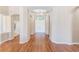 Bright foyer with hardwood floors leads into the open-concept living space at 2250 Mountain Ash Way, New Port Richey, FL 34655