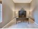 Dedicated home office space with desk and built-in shelving at 2250 Mountain Ash Way, New Port Richey, FL 34655
