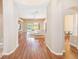Inviting living room with open access to an outdoor pool and green backyard at 2250 Mountain Ash Way, New Port Richey, FL 34655