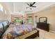 Spacious main bedroom offers three windows and a view of the pool at 2250 Mountain Ash Way, New Port Richey, FL 34655