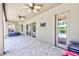 Covered patio with stone pavers, ceiling fans, and a view of the pool at 2250 Mountain Ash Way, New Port Richey, FL 34655
