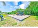 A bright, modern playground with multiple slides and swings, promising hours of fun at 2250 Mountain Ash Way, New Port Richey, FL 34655