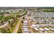 Sweeping aerial perspective displaying a vast mobile home community near coastal highway with amenities at 262 S Port Royal Ln, Apollo Beach, FL 33572
