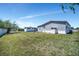 Expansive grassy backyard offering ample space and potential for landscaping and outdoor activities at 262 S Port Royal Ln, Apollo Beach, FL 33572