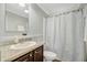 Clean bathroom featuring a sink with counter space, a shower with curtain, and neutral tones for a soothing atmosphere at 262 S Port Royal Ln, Apollo Beach, FL 33572