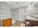 Bright bathroom with dual vanity, walk-in shower, and wood look flooring at 262 S Port Royal Ln, Apollo Beach, FL 33572