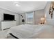 Spacious bedroom with large bed, dresser, and bright natural light at 262 S Port Royal Ln, Apollo Beach, FL 33572