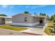 Lovely home featuring a convenient carport and a beautifully maintained exterior with green lawn at 262 S Port Royal Ln, Apollo Beach, FL 33572