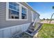Charming home featuring well-maintained siding, bright windows, and a welcoming front entry with steps at 262 S Port Royal Ln, Apollo Beach, FL 33572