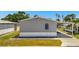 Neat home showcasing simple elegance with a carport and a tidy yard, ideal for comfortable living at 262 S Port Royal Ln, Apollo Beach, FL 33572