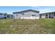Exterior of the home featuring tidy yard space and practical utility connections at 262 S Port Royal Ln, Apollo Beach, FL 33572