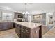 Well-appointed kitchen with a center island offering extra storage and prep space, and stylish lighting at 262 S Port Royal Ln, Apollo Beach, FL 33572