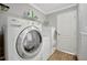 Functional laundry room with modern washer and dryer, shelving for storage, and a clean, organized space at 262 S Port Royal Ln, Apollo Beach, FL 33572