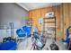 Storage room with exposed framing, utility storage and blue garbage can at 262 S Port Royal Ln, Apollo Beach, FL 33572