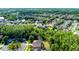 Aerial view showcasing property lines within a lush, green residential community with abundant trees and well-maintained lawns at 27549 Stonecreek Way, Wesley Chapel, FL 33544