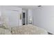 Simple bedroom features hardwood floors and a spacious closet at 27549 Stonecreek Way, Wesley Chapel, FL 33544