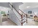 Spacious entryway with staircase leading to an open-concept living area at 27549 Stonecreek Way, Wesley Chapel, FL 33544