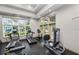 Community gym area featuring treadmills, weights and large windows at 27549 Stonecreek Way, Wesley Chapel, FL 33544