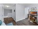 Bright hallway with hardwood floors and views of the upper and lower levels at 27549 Stonecreek Way, Wesley Chapel, FL 33544