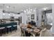 Eat-in kitchen with white cabinetry, stainless steel appliances, and a large island at 27549 Stonecreek Way, Wesley Chapel, FL 33544