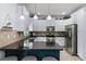 Updated kitchen featuring stainless steel appliances, white cabinets, and black granite counters at 27549 Stonecreek Way, Wesley Chapel, FL 33544