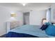 Bedroom with natural light, hardwood floors, king bed, and stylish decor for a modern look at 27549 Stonecreek Way, Wesley Chapel, FL 33544