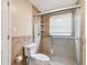 Bathroom featuring decorative tiles, glass enclosed shower, showerhead, and toilet at 284 Peninsula Ave, Tarpon Springs, FL 34689