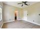 Bedroom with tile flooring and multiple doors at 284 Peninsula Ave, Tarpon Springs, FL 34689