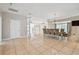 Spacious dining room featuring tile flooring and a large table for entertaining at 284 Peninsula Ave, Tarpon Springs, FL 34689