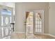 Elegant foyer showcases glossy tile floors and entry to the living room with a french door at 284 Peninsula Ave, Tarpon Springs, FL 34689
