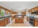 Spacious kitchen with ample cabinet space, island, and stainless steel appliances at 284 Peninsula Ave, Tarpon Springs, FL 34689