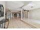 Bright living room with tile flooring, high ceilings, and decorative columns at 284 Peninsula Ave, Tarpon Springs, FL 34689
