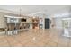Expansive living space showcasing tile flooring, dining area, and open layout at 284 Peninsula Ave, Tarpon Springs, FL 34689
