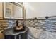 Close-up of the powder room with custom vanity and decorative mirror at 284 Peninsula Ave, Tarpon Springs, FL 34689
