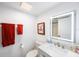 Bright bathroom featuring a modern sink, toilet, and well-lit mirror, enhancing functionality at 2900 Cove Cay Dr # 1B, Clearwater, FL 33760