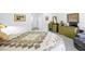 Comfortable bedroom with light green furnishings and a decorative quilted bedspread at 2900 Cove Cay Dr # 1B, Clearwater, FL 33760