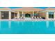 Resort-style community pool with ample lounge seating and umbrellas at 29823 Ganga Way, Wesley Chapel, FL 33543