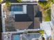 Bird's eye view of home's roof, backyard pool, and neighboring houses at 3139 Elkridge Dr, Holiday, FL 34691