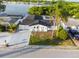 Aerial view showcases the home's curb appeal, palm trees, and proximity to the water at 3139 Elkridge Dr, Holiday, FL 34691