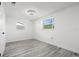Clean bedroom with laminate flooring, recessed lighting, and bright windows at 3139 Elkridge Dr, Holiday, FL 34691