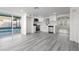 Updated open concept kitchen features all white cabinets, stainless appliances, and pool views at 3139 Elkridge Dr, Holiday, FL 34691